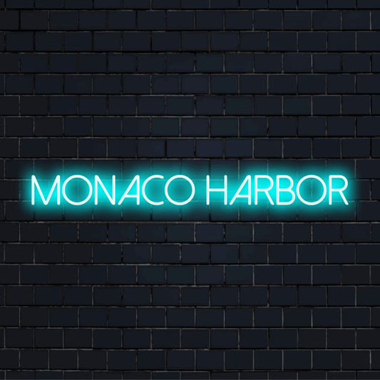 Monaco Harbor Neon Sign, bright neon glow against brick backdrop