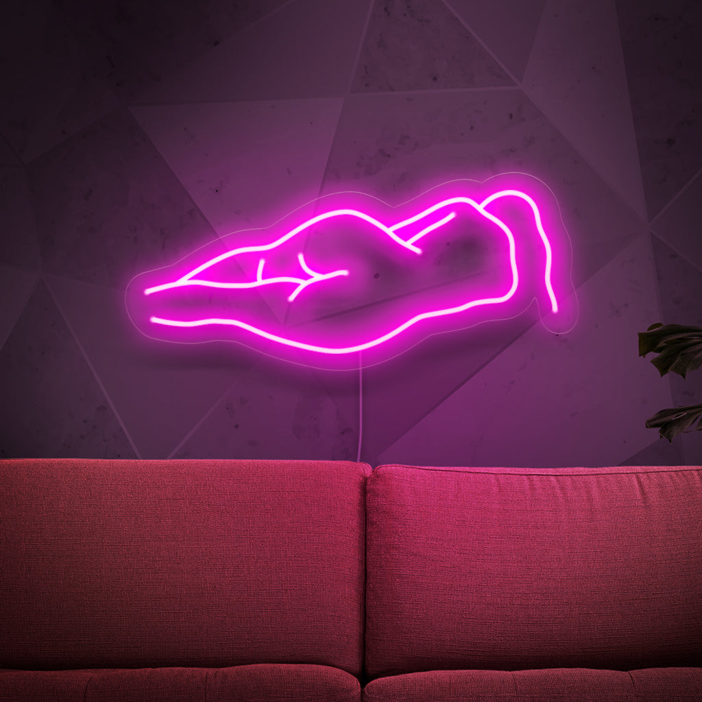 Het neonbord met een naakt vrouwenlichaam is een artistieke toevoeging aan uw interieur. Het straalt een sensueel en betoverend licht uit.