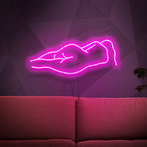 Het neonbord met een naakt vrouwenlichaam is een artistieke toevoeging aan uw interieur. Het straalt een sensueel en betoverend licht uit.