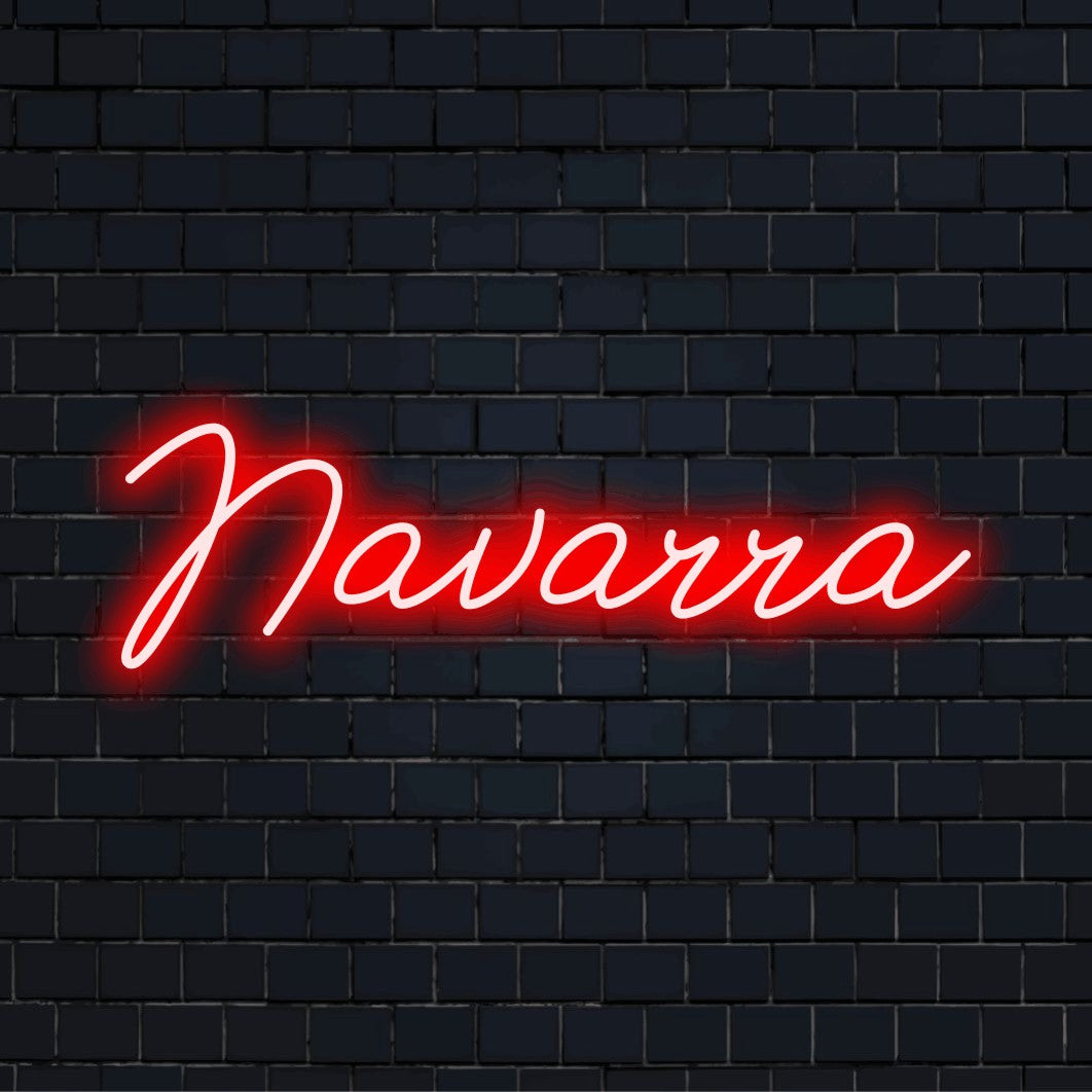 Navarra Neon Light with bright neon lettering on dark brick background