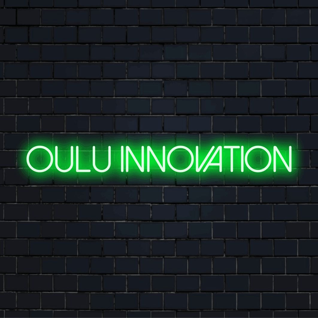 Oulu Innovation Neon Light with bright neon lettering on dark brick wall