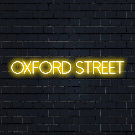Oxford Street LED Neon Sign, bright neon lettering on dark brick wall