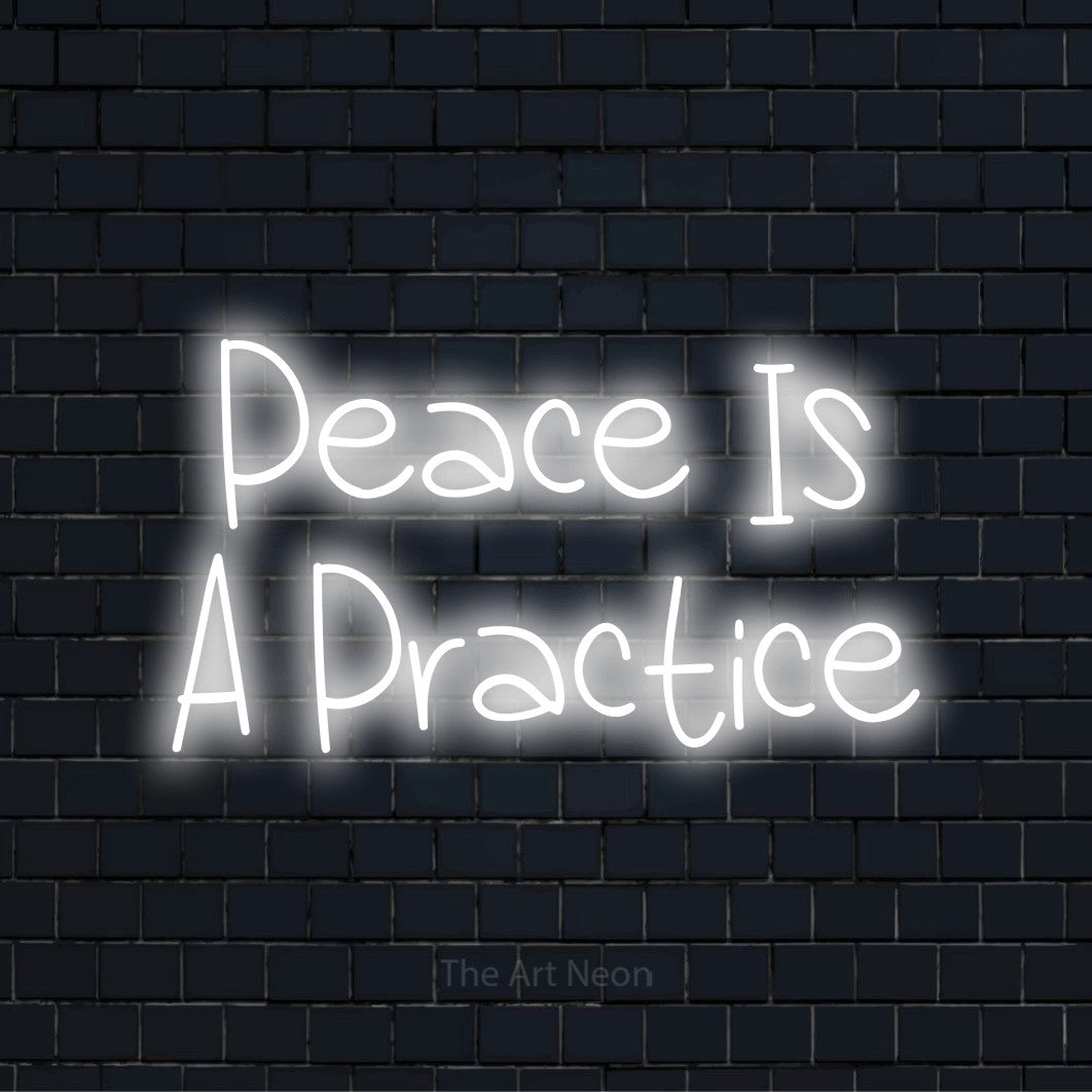 "Peace Is A Practice" LED neon sign on a black brick wall