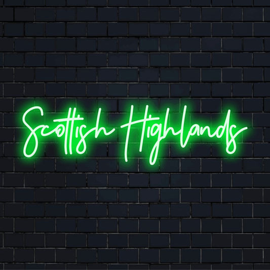 Scottish Highlands Neon Light with bright neon lettering against brick backdrop