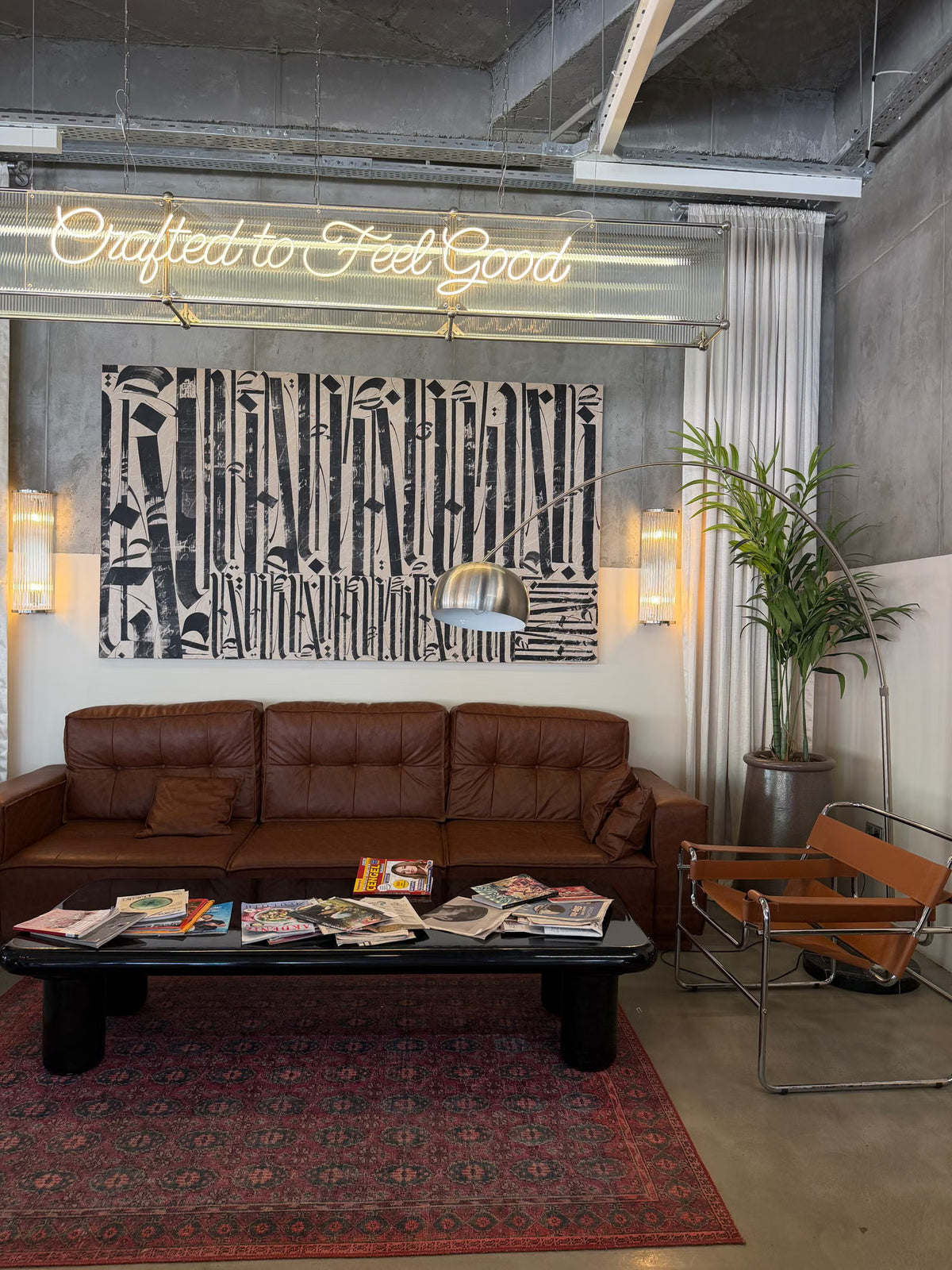 Script logo LED neon sign installed in an elegant hospitality lounge
