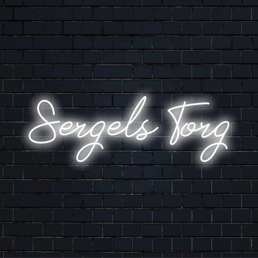 Sergels Torg Neon Sign, bright neon lettering against black brick wall