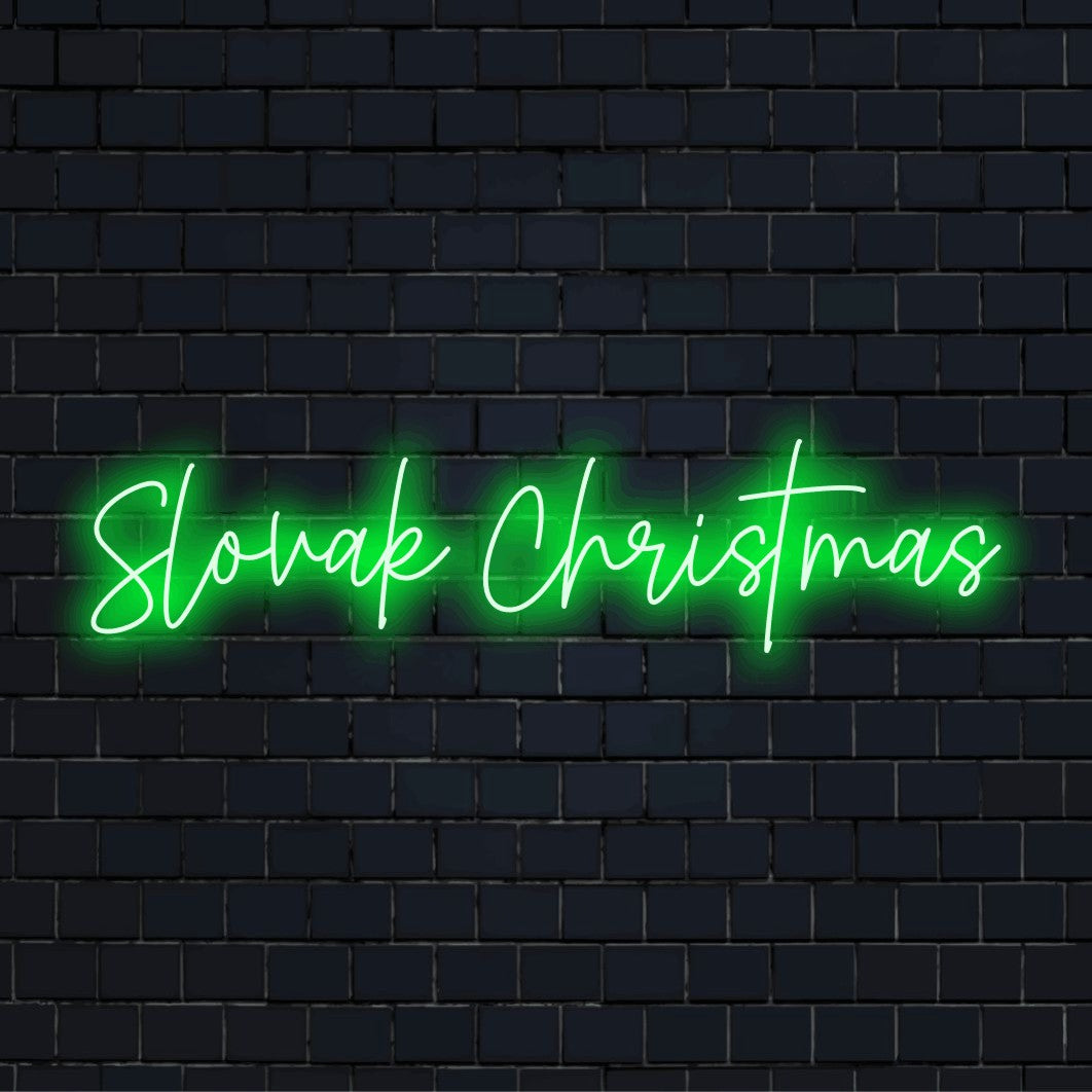 Slovak Christmas Neon Light with glowing lettering on dark brick wall