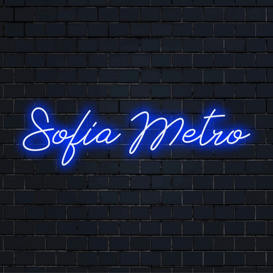 Sofia Metro Neon Light with bright neon lettering against brick backdrop