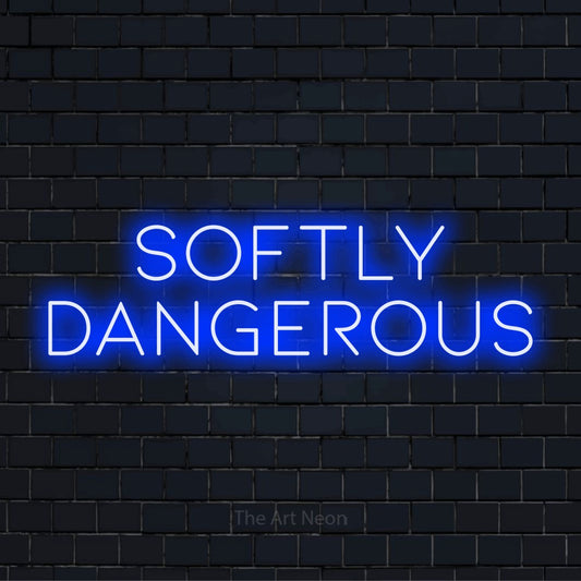 "Softly Dangerous" text design with neon effect on a black brick wall