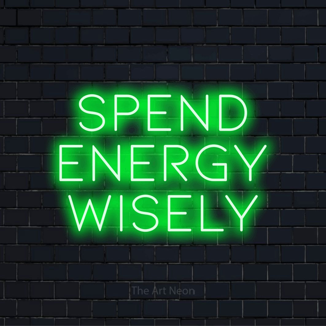 "Spend Energy Wisely" glowing LED neon sign on a black brick wall