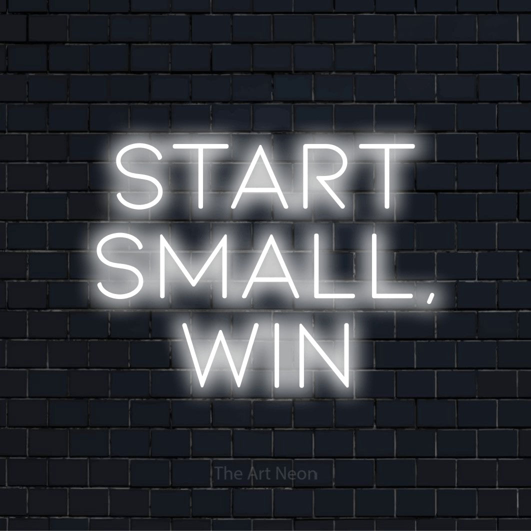 "Start Small, Win" neon text design on a black brick wall