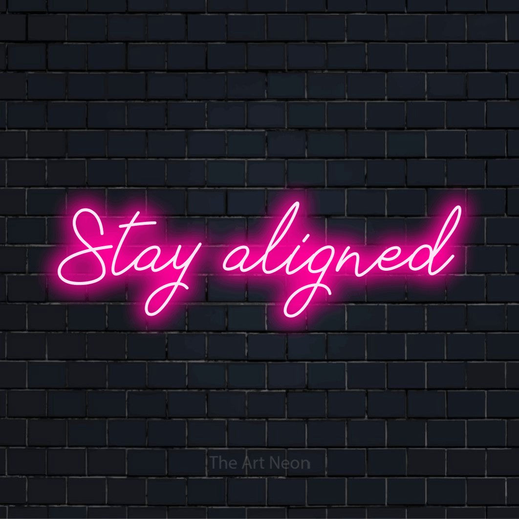 "Stay Aligned" text design with neon effect on a black brick wall