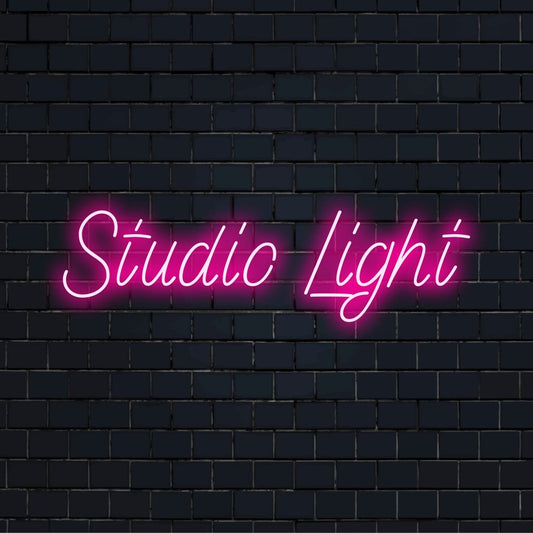 Studio Light Neon Sign, soft neon glow on dark brick wall