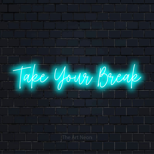 "Take Your Break" neon text design on a black brick wall
