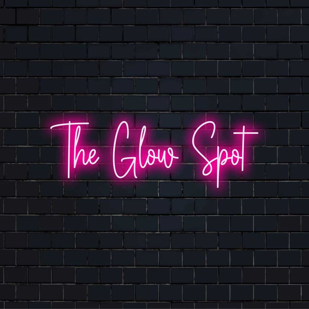 The Glow Spot Neon Light with soft neon glow against brick backdrop