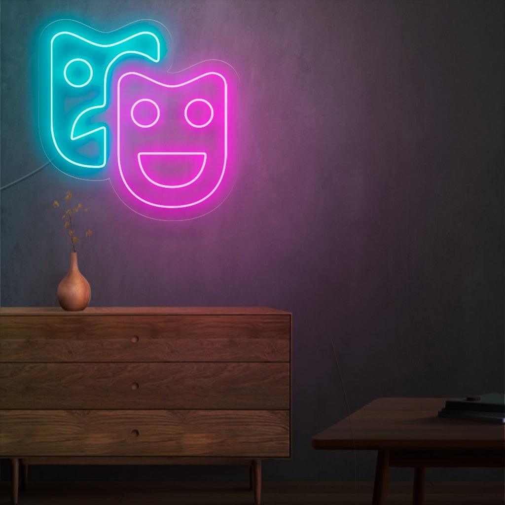 Een betoverend neonbord met theatermaskers, die drama en podiumkunsten symboliseren. Dit bord voegt een vleugje elegantie en charme toe aan elke entertainmentlocatie.