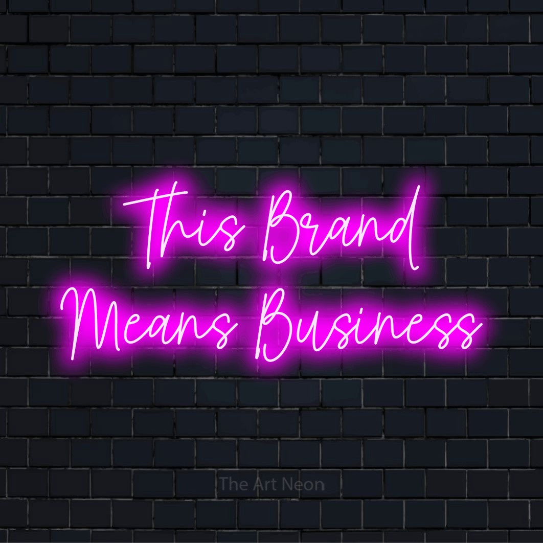 "This Brand Means Business" LED neon sign on a black brick wall