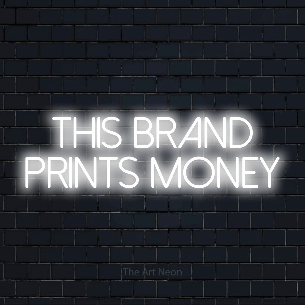 "This Brand Prints Money" glowing LED neon sign on a black brick wall