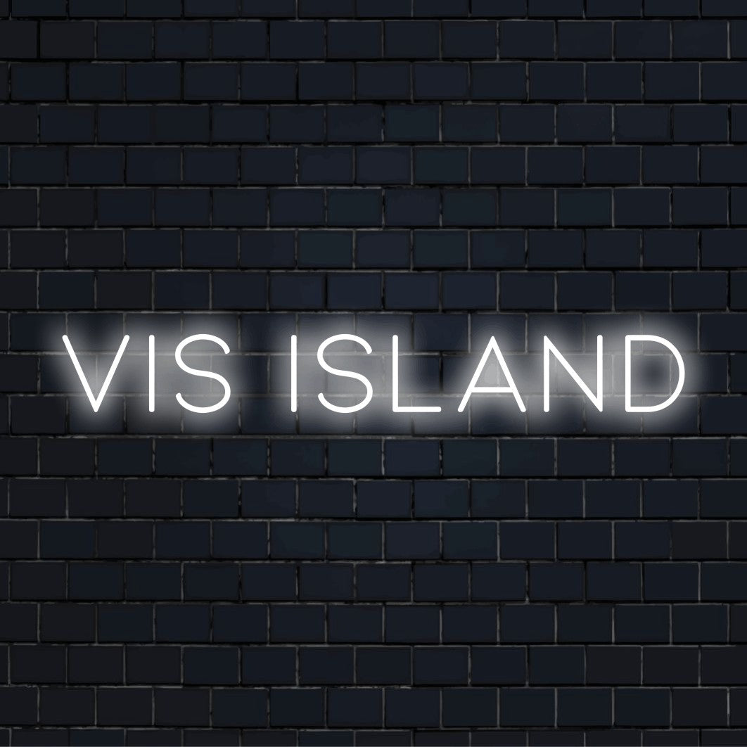 Vis Island Neon Light with bright neon lettering against brick backdrop