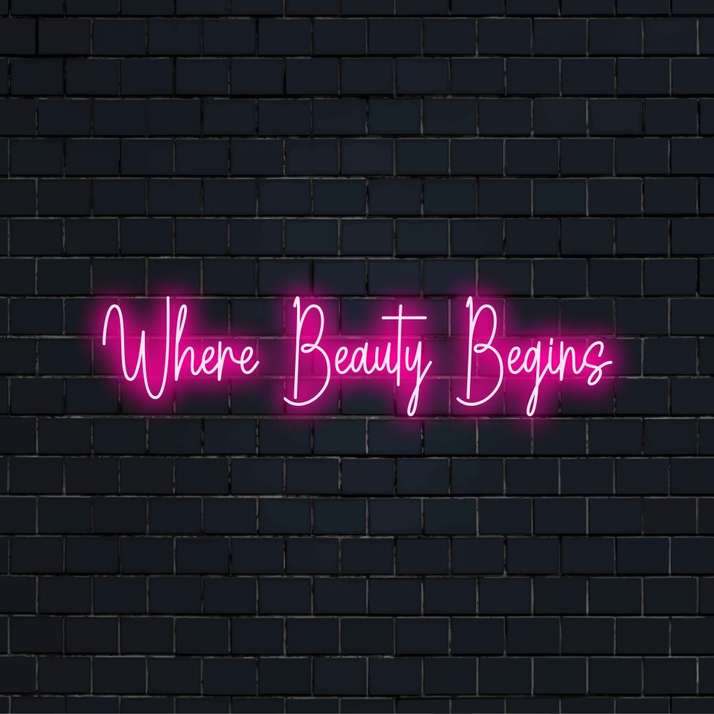 Where Beauty Begins Neon Light with glowing wall decor against black brick wall