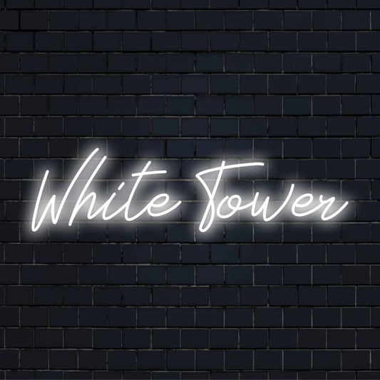 White Tower LED Neon Sign, bright LED glow against black brick wall