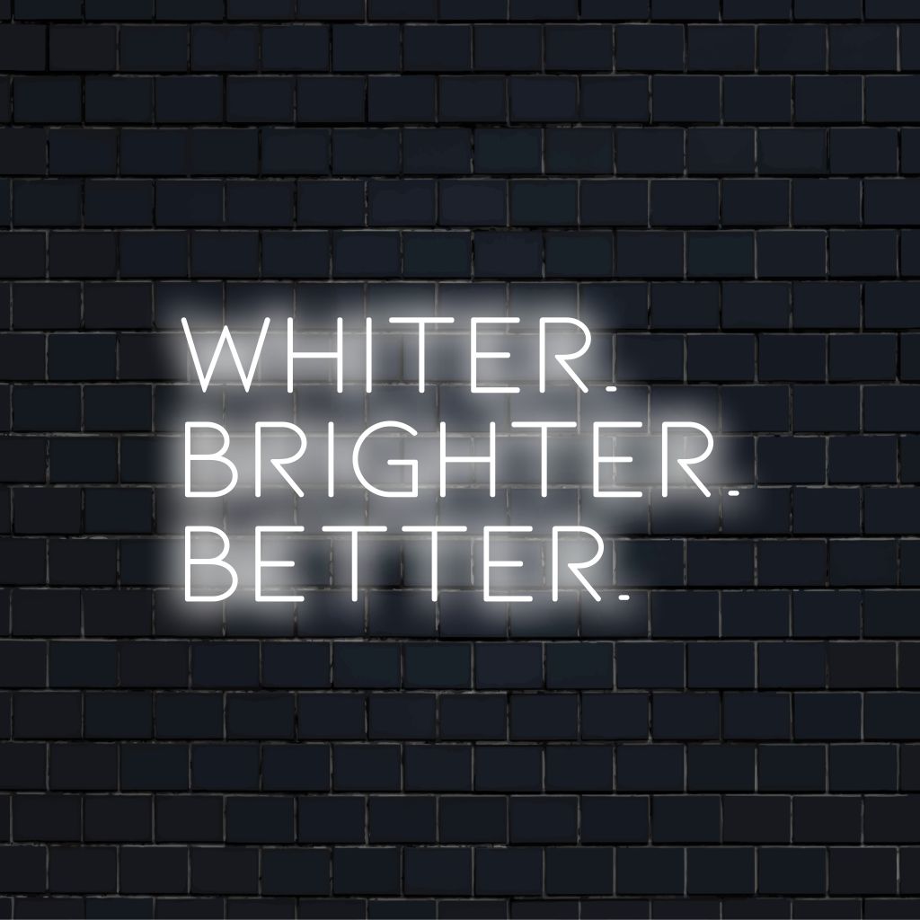 Whiter Brighter Better Neon Sign, soft neon glow on dark brick background