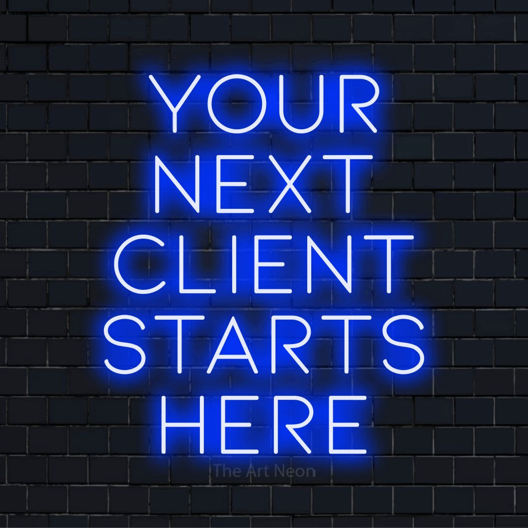 "Your Next Client Starts Here" LED neon sign on a black brick wall