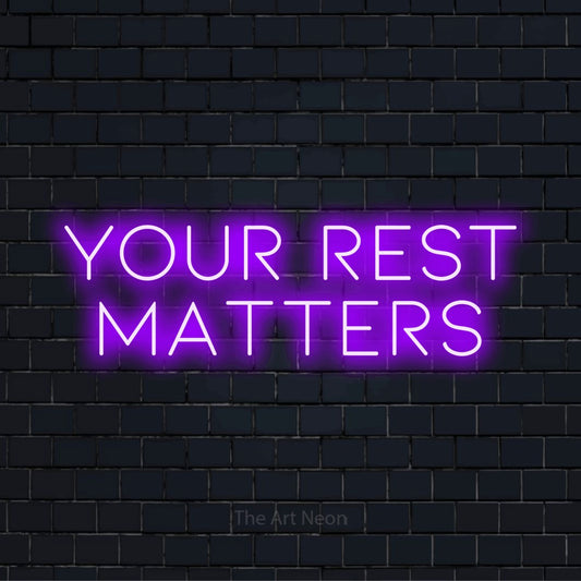 "Your Rest Matters" glowing LED neon sign on a black brick wall
